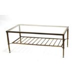 A 1960's Maison Jansen style lacquered brass and glass two-tier rectangular coffee table, 102cms (