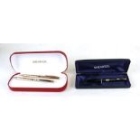 A Sheaffer gold plated pen and pencil set, cased; together with another similar ballpoint pen,