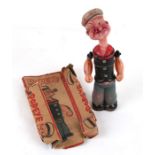 A 1929 celluloid clockwork figure of Popeye with original box.Condition ReportThe neck appears to