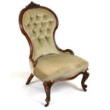 A Victorian walnut upholstered balloon back nursing chair.Condition Reportgeneral wear