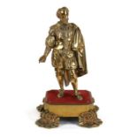 A gilt bronze figure depicting Sir Francis Drake mounted on a square plinth with shell feet, overall