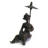 A Japanese style bronze figure in the form of a seated man holding a parasol, 14cms (5ins) high.