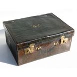 An early 20th century green leather crocodile skin travelling case by Allen, The Strand, London,