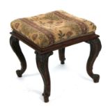 A 19th century mahogany footstool with acanthus carved cabriole legs on scroll feet, 40cms (16ins)