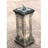 A brass sundial on a reconstituted stone column, 56cms (22ins) high.