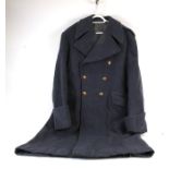 A post WW2 Royal Air Force Squadron Leader great coat by Gieves dated 2/51, having brass buttons
