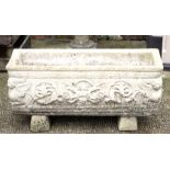 A reconstituted stone rectangular planter, 71cms (28ins) wide.