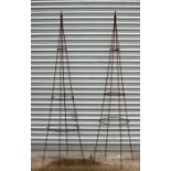 A pair of metal plant support obelisks, 196cms (77ins) high (2).