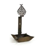 A Middle Eastern engraved brass wall mounted oil lamp, 34cms (13.5ins) high; together with a Hindu