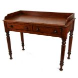A Victorian mahogany side table with two frieze drawers, on turned legs, 106cms (41.5ins) wide.