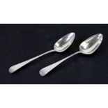 A matched pair of George III silver Old English pattern serving spoons, initialled, Exeter 1808-
