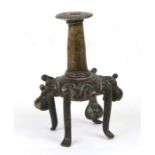 An antique Asian bronze joss stick holder or incense burner standing on four legs, 13 cms (5 ins).