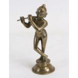 An Asian bronze figure depicting a musician, 15cms (6ins) high.