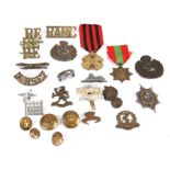 A quantity of military cap badges and buttons, various regiments.