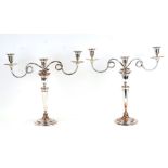 A large pair of George III Old Sheffield Plate three-arm candelabra, 49cms (19.25ins) high.Condition