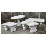 A painted reconstituted stone garden suite comprising a circular pedestal table, a bench and two