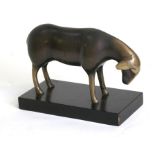 A modern bronze / brass patinated model of a sheep, 18cms (7ins) long.