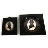 Two portrait miniature silhouettes mounted in ebonised frames, one inscribed to verso.