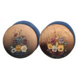 A pair of toleware wall plates decorated with pansies, 31cms (12ins) diameter (2).