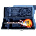 A Tokai Love Rock Les Paul style left-handed electric guitar, cased.