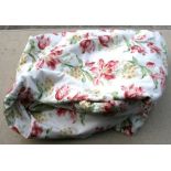 A pair of lined curtains with floral sprays on a white ground, 77ins wide and 82ins drop,