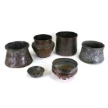 Six Indian / Persian copper bowls with repousse decoration, the largest 15cms (6ins) high.