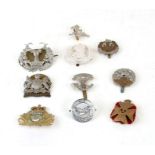 An assortment of ten British Military cap badges including: Kings Royal Rifle Corps, Cameron