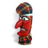 A Folk Art carved and painted wooden 'Mr Punch' head, 26cms (10ins) high.