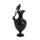 A Grand Tour style bronze jug with eagle crest in the ancient Roman manner, 24cms (9.5ins) high.