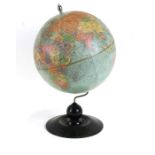 A Replogle Globe, Chicago, on a turned wooden stand, 49cms (19ins) high.