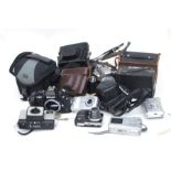 A Nikon f-501 camera; together with other cameras and camera equipment.