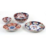 A group of four late 19th century Japanese Imari bowls and dishes, the largest 21cms (8.25ins)
