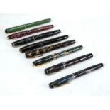 A quantity of eight fountain pens to include Conway Stewart and Parker, some with gold nibs (8).