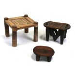 An African carved wooden stool; together with two similar stools (3).Condition Reportlargest -