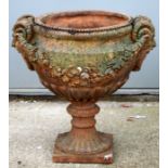 A terracotta urn of classical form, 46cms (18ins) diameter.