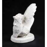 A blanc de chine style figure of a cockerel, 20cms (8ins) high.