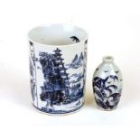 A Chinese blue and white porcelain brush pot decorated with three landscape scenes, 10.5 cms (4.25