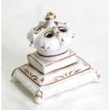A 19th century Staffordshire pottery pen holder in the form of a crown on a pillow, 9cms (3.5ins)