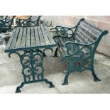 A cast iron and wooden slatted garden bench, 127cms (50ins) wide; together with a matching garden