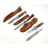 Three Solingen sheath knives with antler handles, the largest 28cms (11ins) long, all with leather