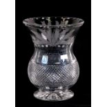 An Edinburgh crystal vase of baluster form with engraved thistle decoration, 20cms (8ins) high.