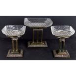 An Elkington style three-piece table garniture, each with a cut glass bowl for sweetmeats or