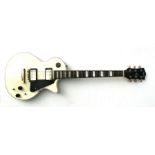 A Lindo Les Paul copy electric guitar.Condition Reporttwo knobs missing, one string missing, some