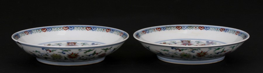 A pair of Chinese shallow dishes decorated with foliate scrolls, blue seal mark to the underside, - Image 2 of 13