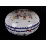 A Chinese famille rose box and cover of compressed globular form, decorated with playing children,