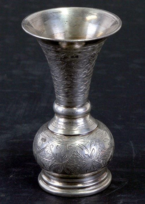 An Egyptian silver coloured metal vase of flared trumpet form with engraved decoration, weight 100g,