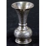 An Egyptian silver coloured metal vase of flared trumpet form with engraved decoration, weight 100g,