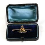 A 15ct gold and enamel Royal Artillery sweetheart brooch, cased.