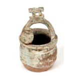 A Chinese Han dynasty pot in the form of a well, 18cms (7ins) high.