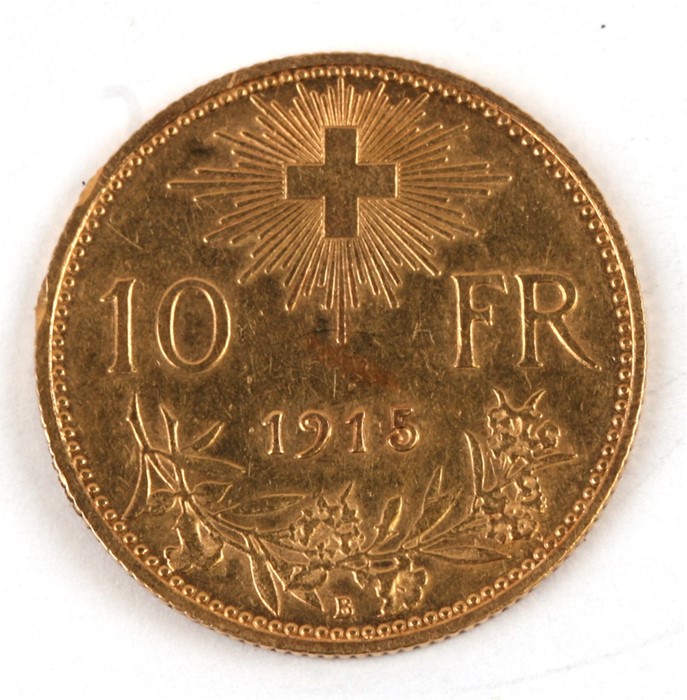 A Swiss 1915 10 francs gold coin.